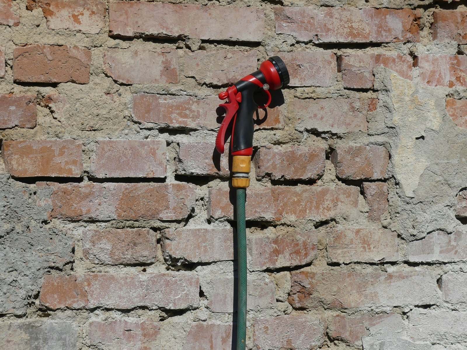 red and black metal tool