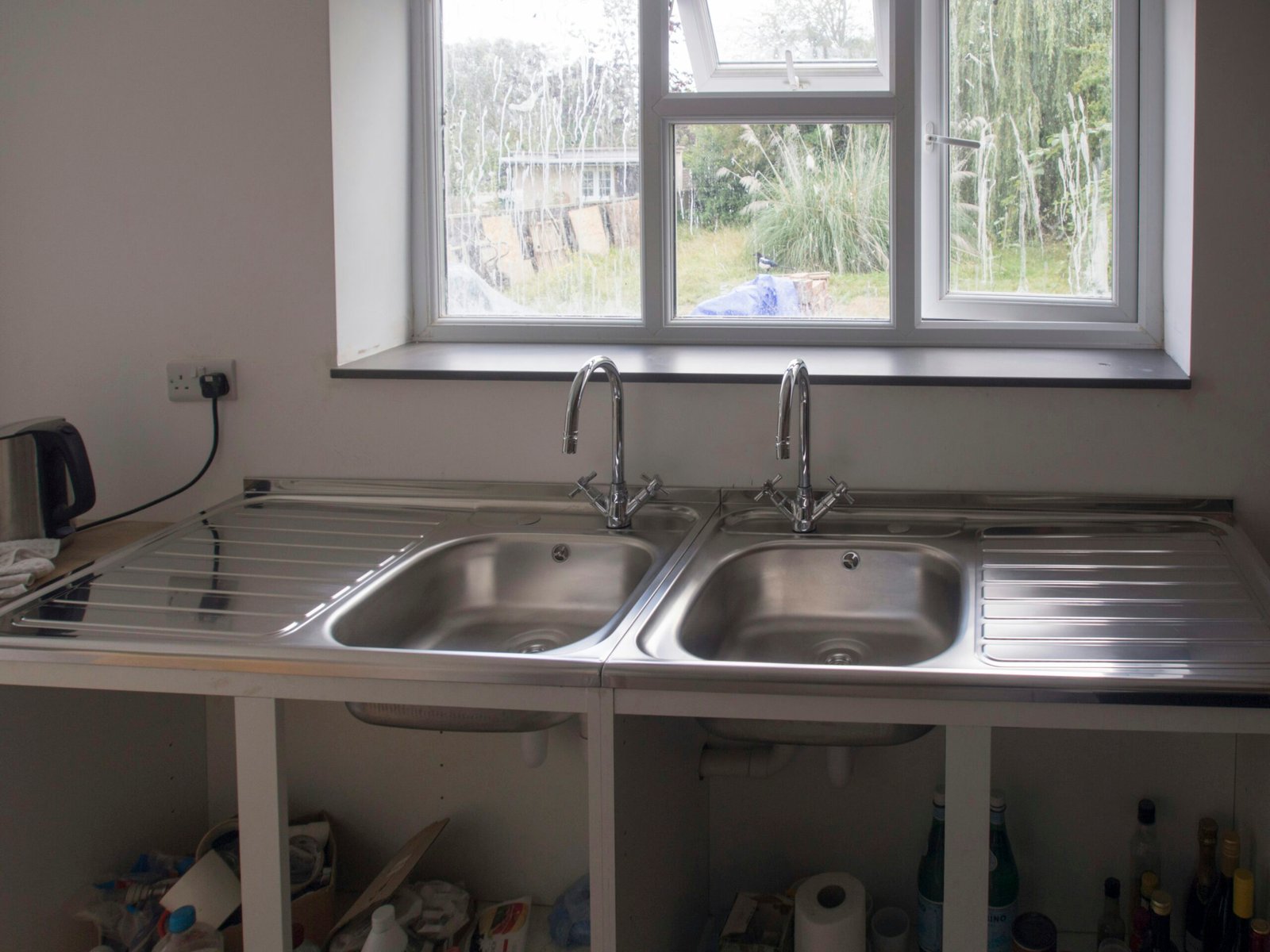 A kitchen with a sink and a window