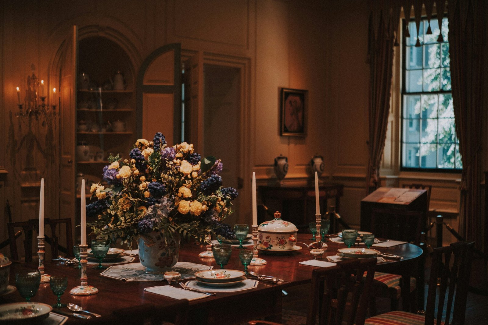 A formal dining room table set for a meal.