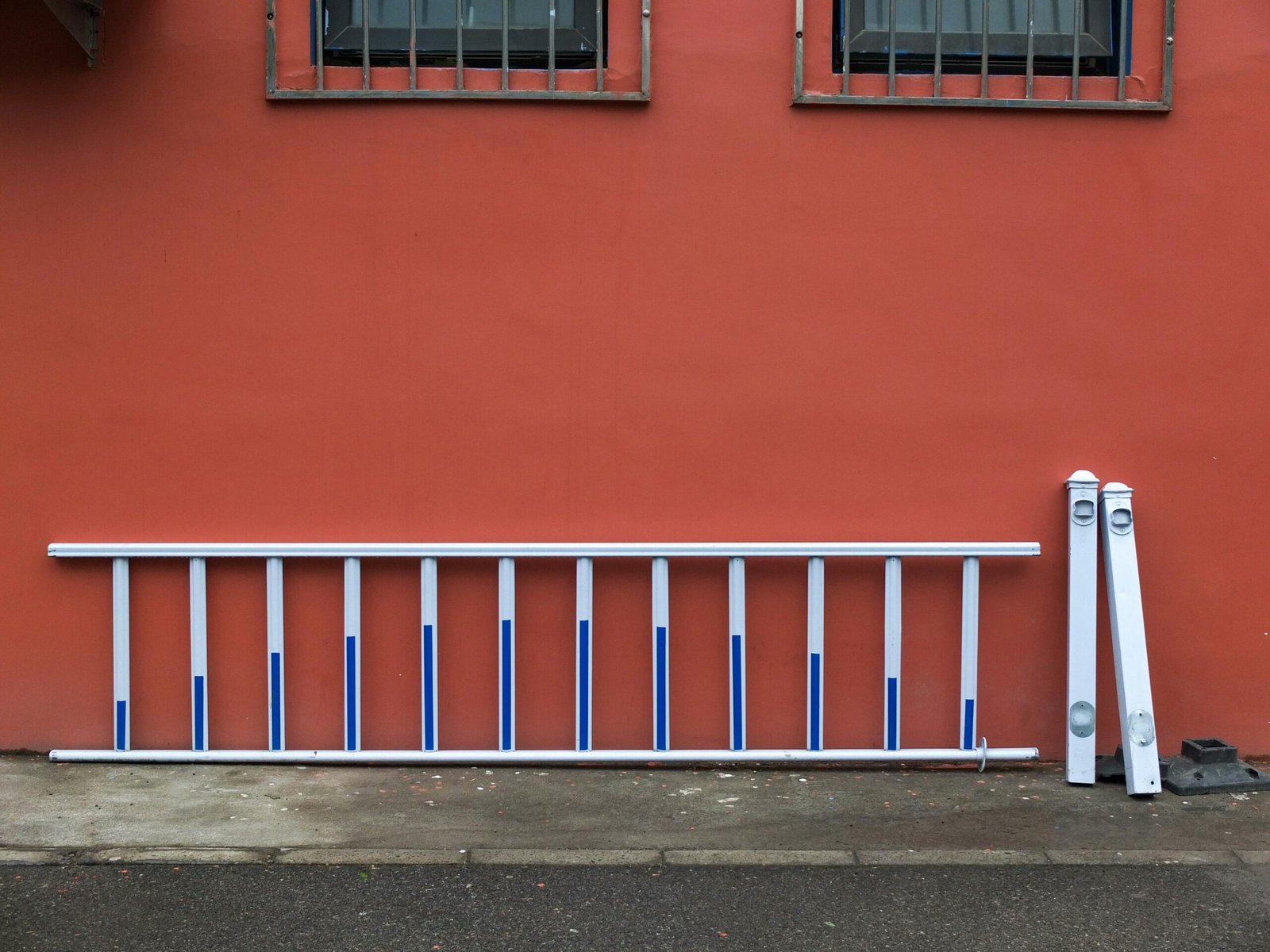 an orange bench in front of a building