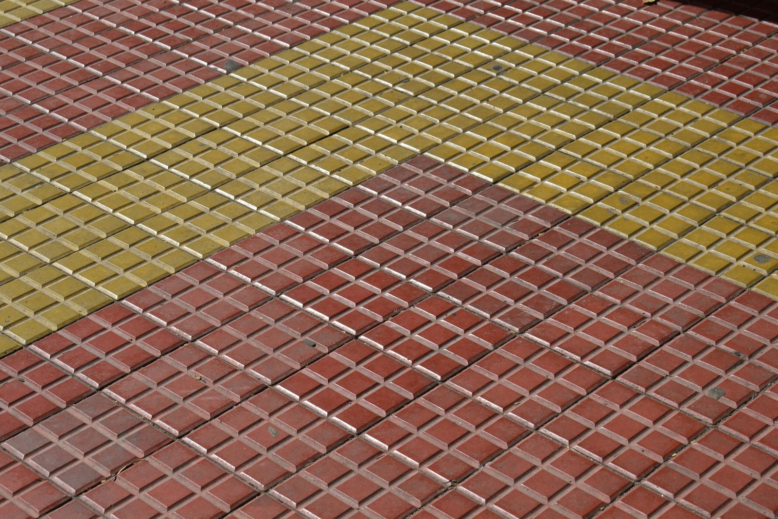 Red and yellow square tiles arranged diagonally.