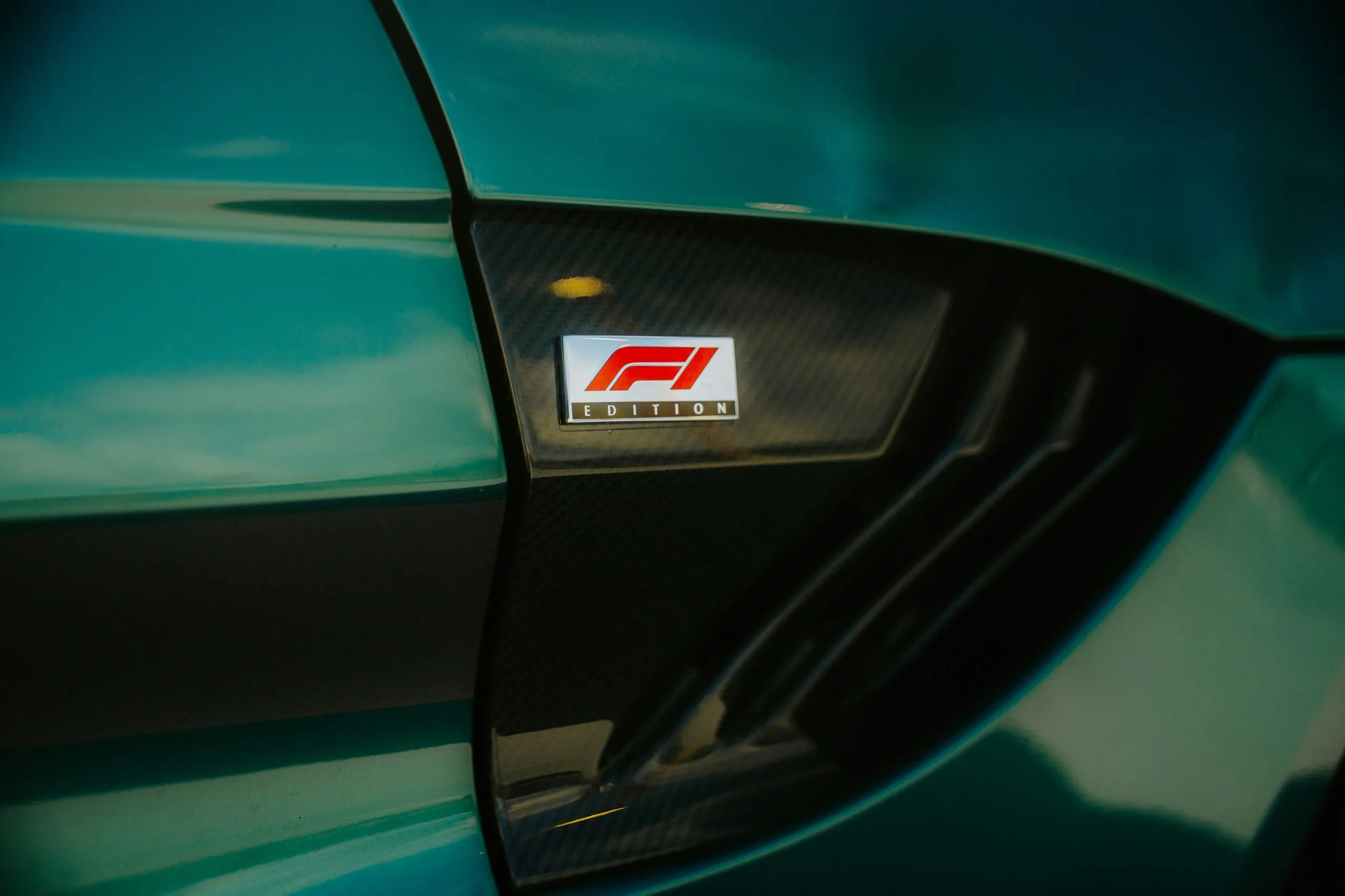 An f1 car emblem is visible on the car.