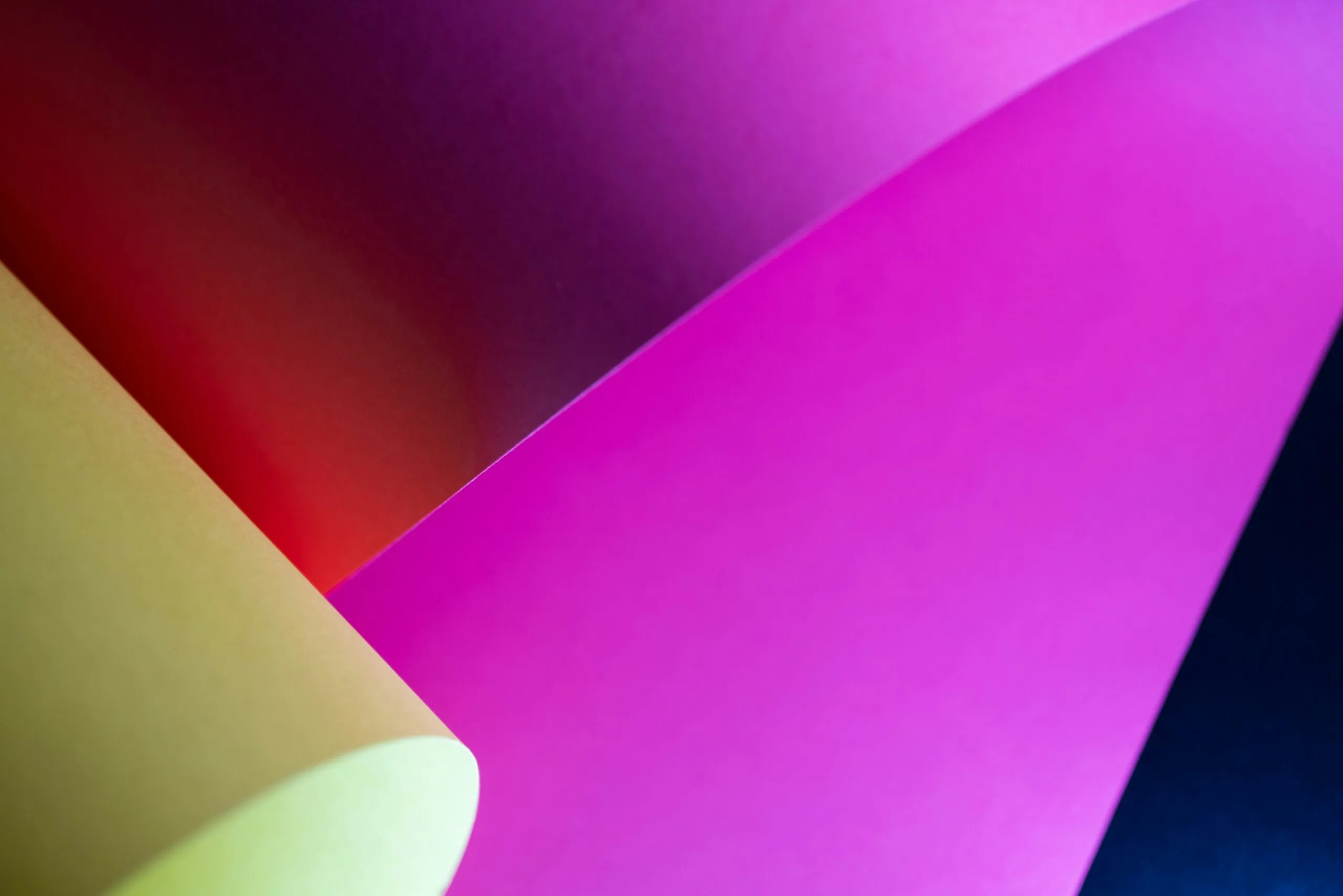 a group of different colored papers stacked on top of each other