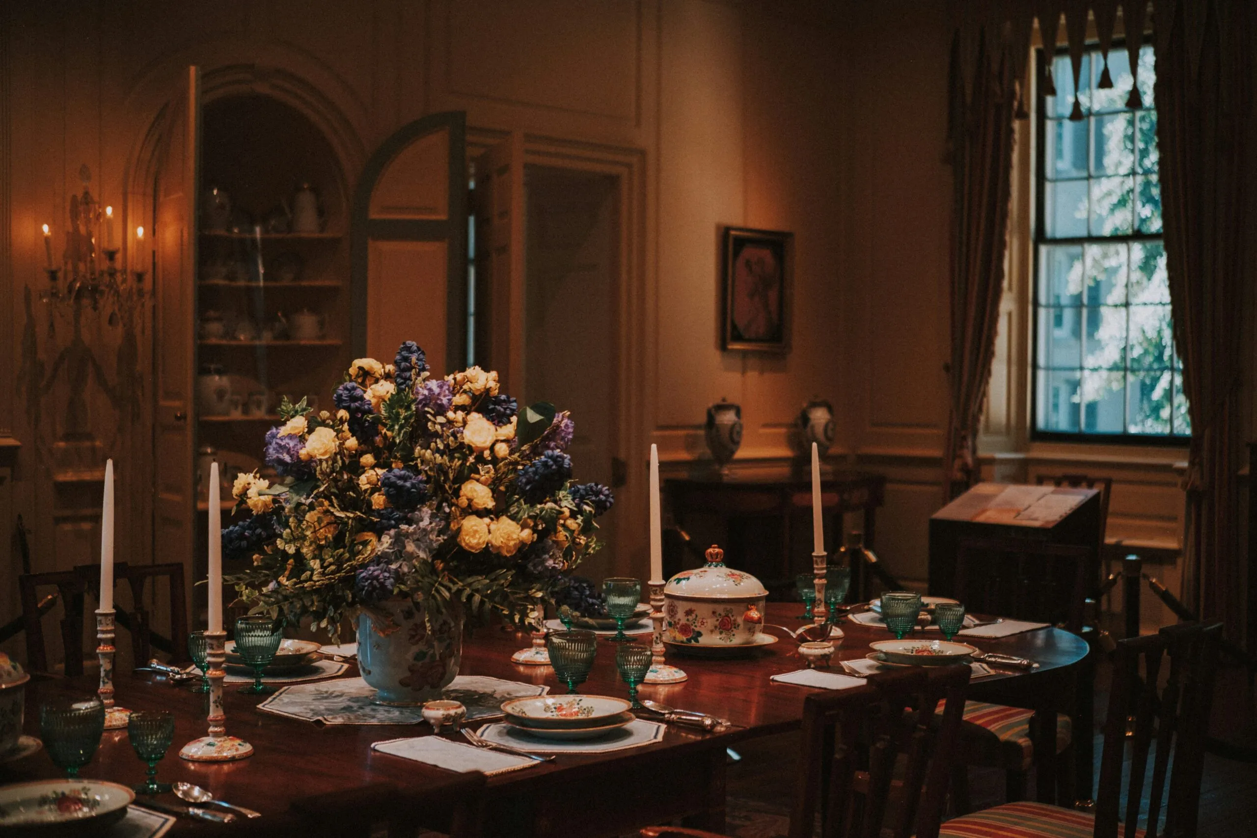 A formal dining room table set for a meal.