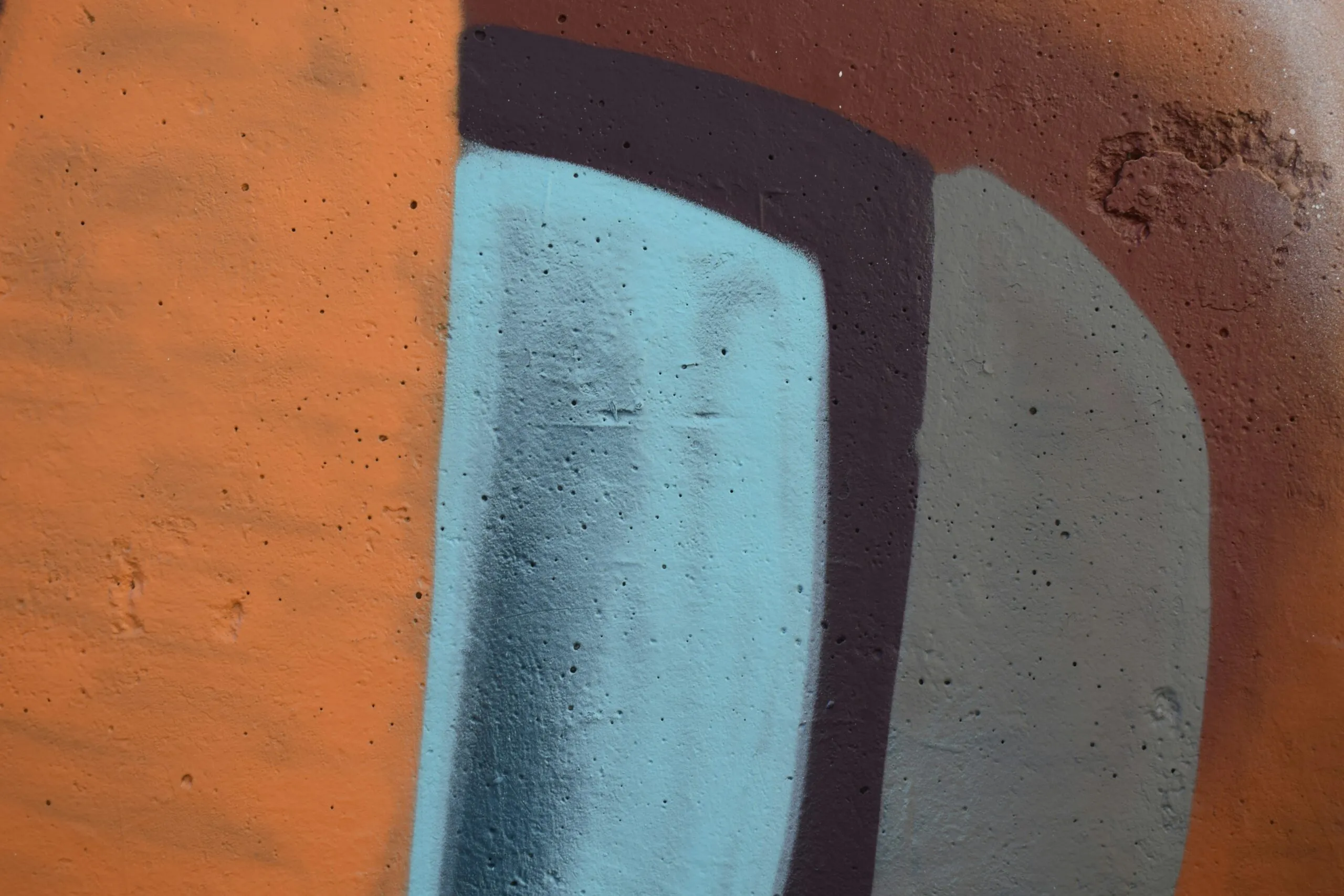 a close up of a wall with a painting on it
