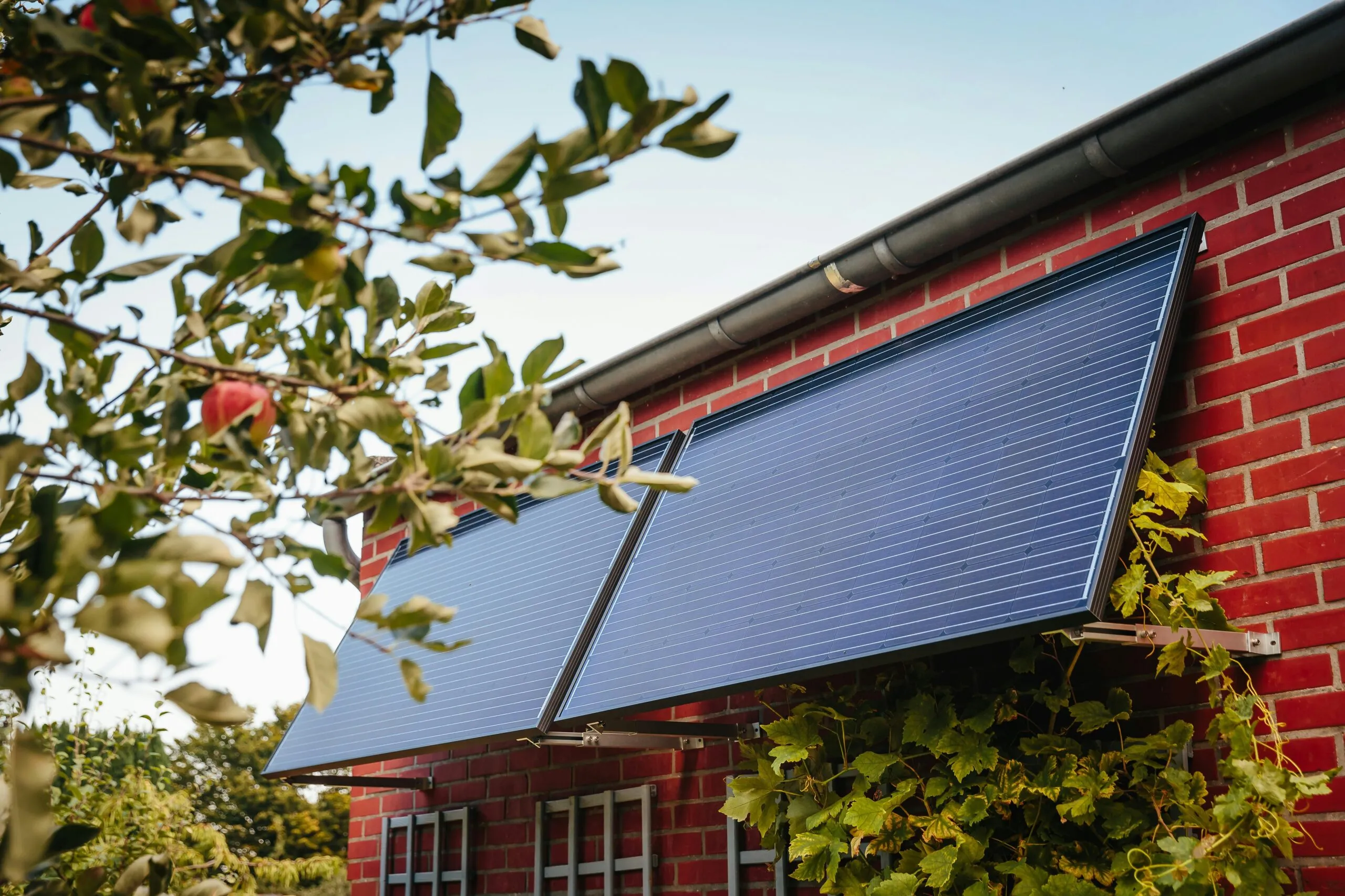 Solar panels mounted on a brick wall