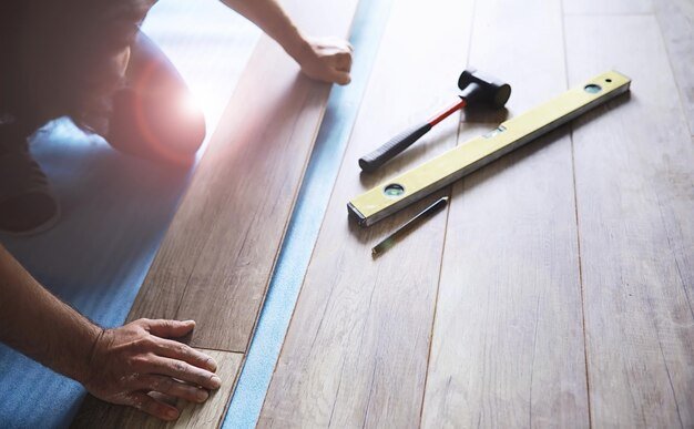 Longitudinal lock joint The sequence of technological methods for laying and installation of floating flooring laminate professional work selective focus