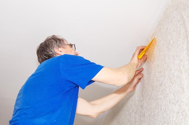 Man renovating wall at home