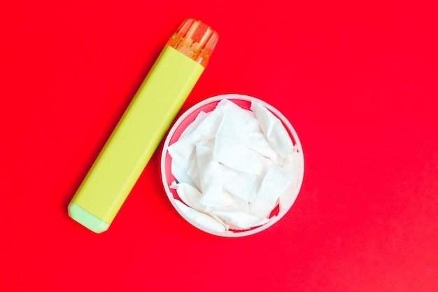 Nicotine pads snus cigarette replacement together with an electronic cigarette