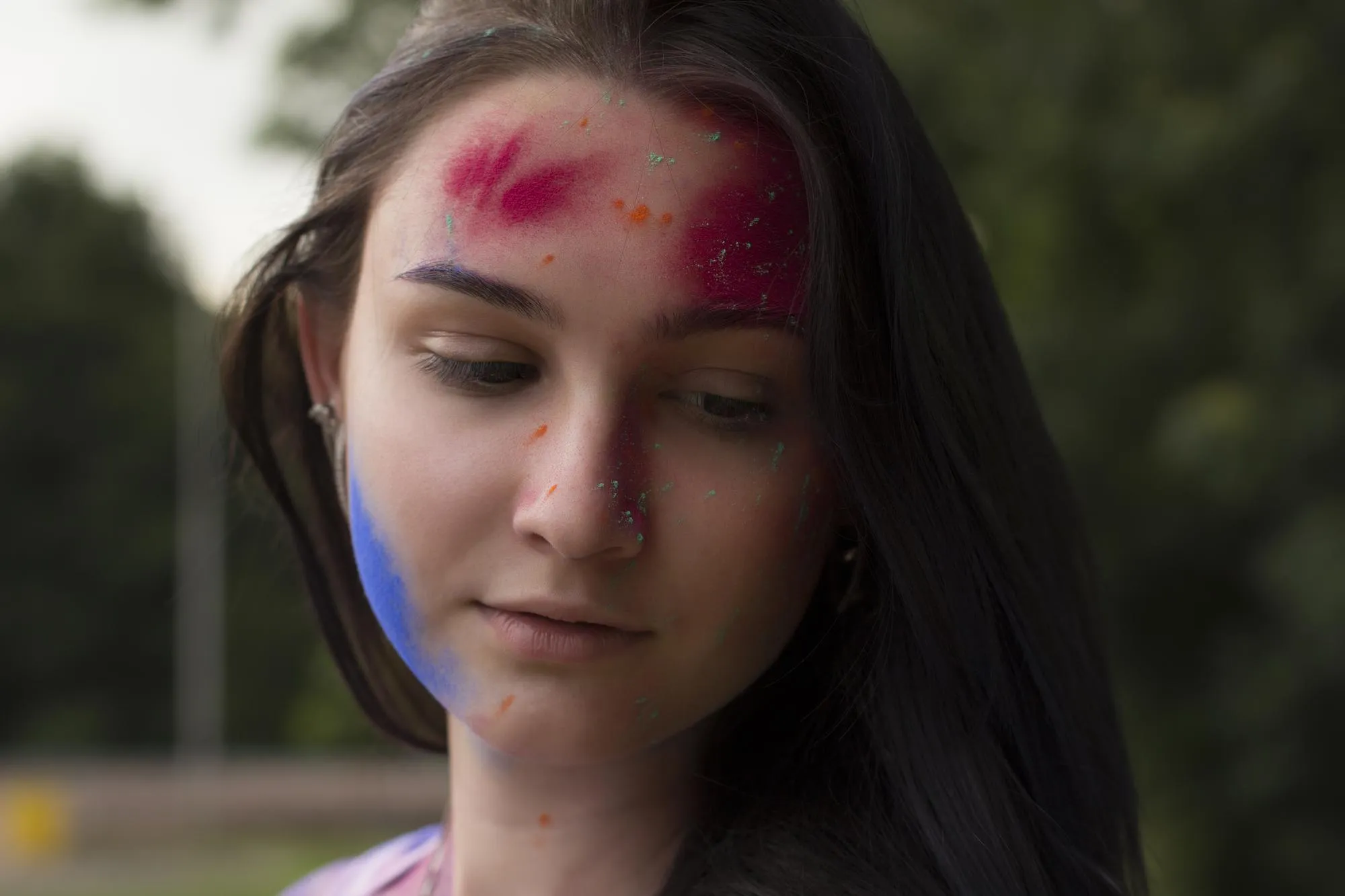 Portrait of brunette woman with dry powder on her face