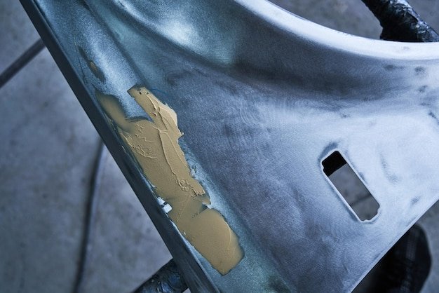 Restoring and painting a car close-up in a car service