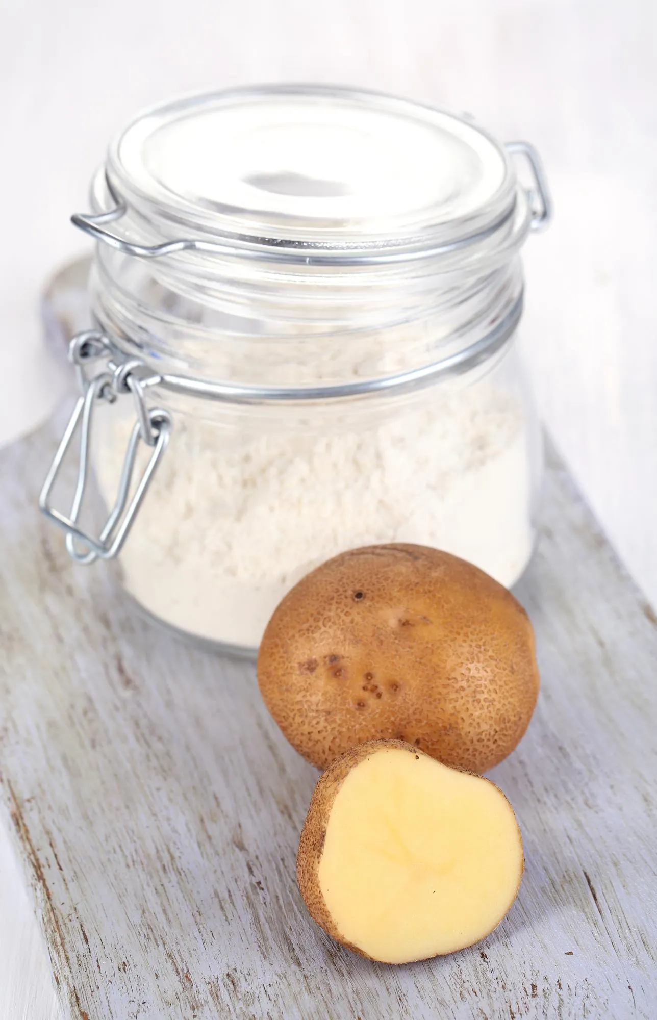 Starch in bank on wooden table closeup