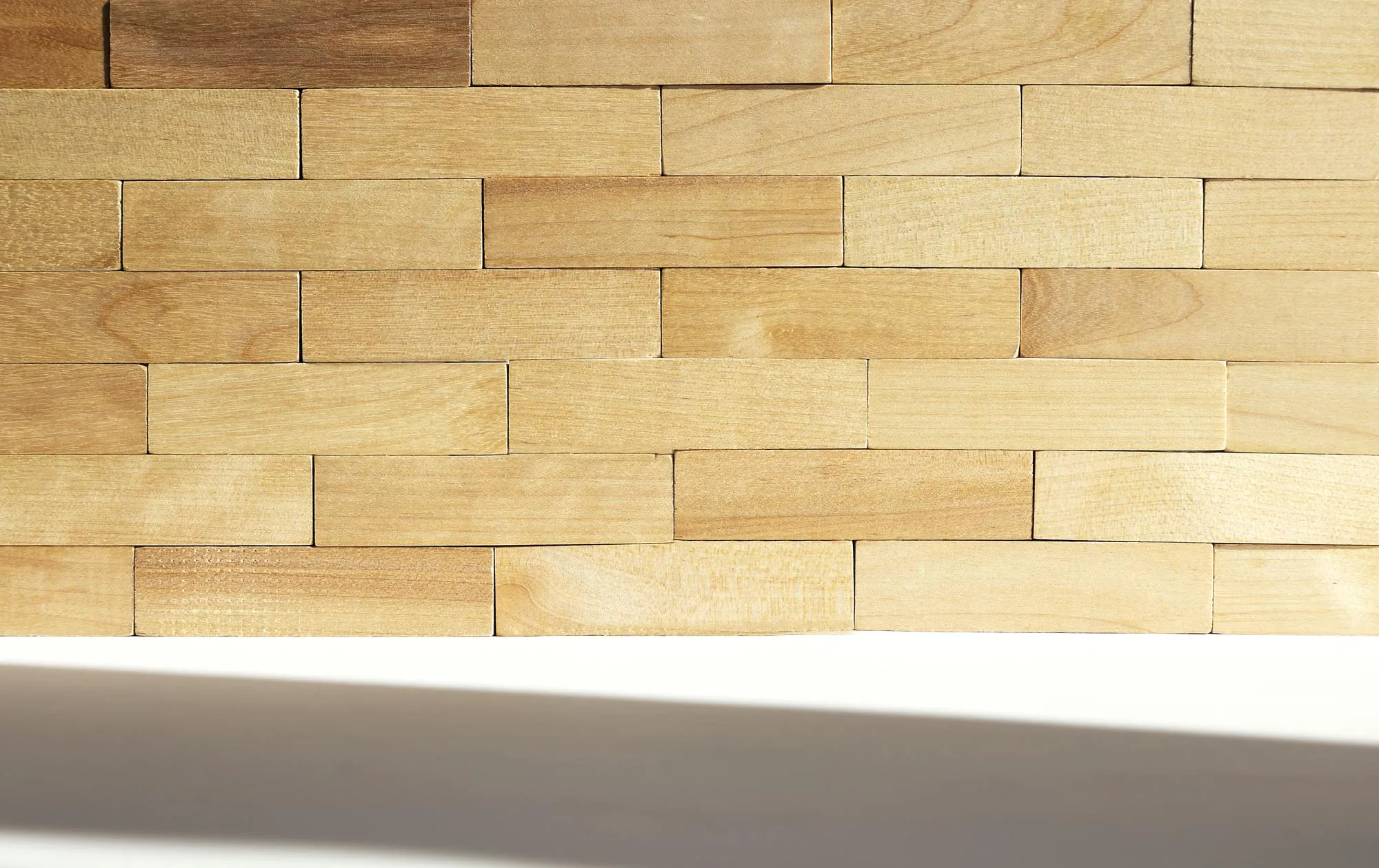A wall of wooden blocks Rustic background for interior design