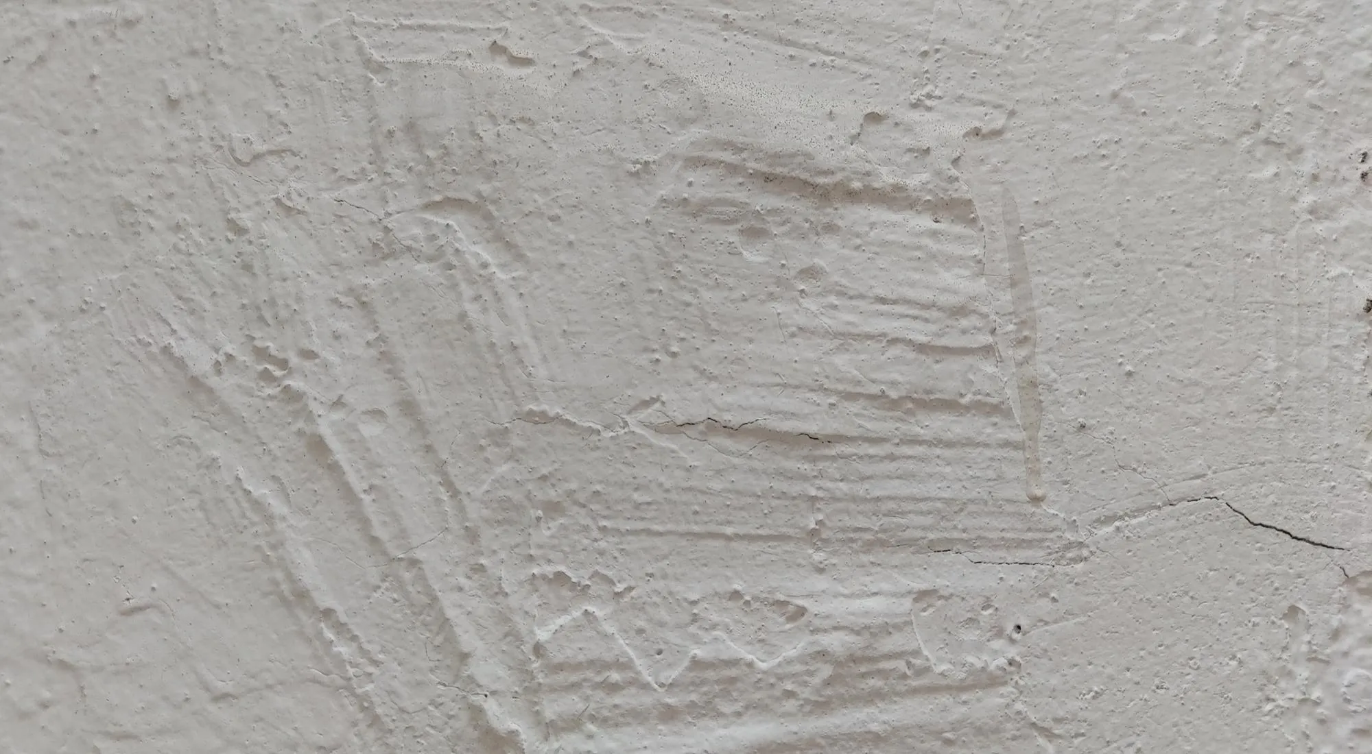 White concrete wall texture, grey plastered wall texture or background, messy street wall