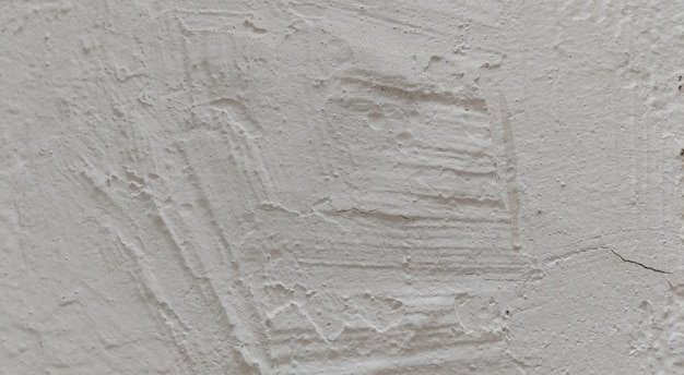 White concrete wall texture, grey plastered wall texture or background, messy street wall