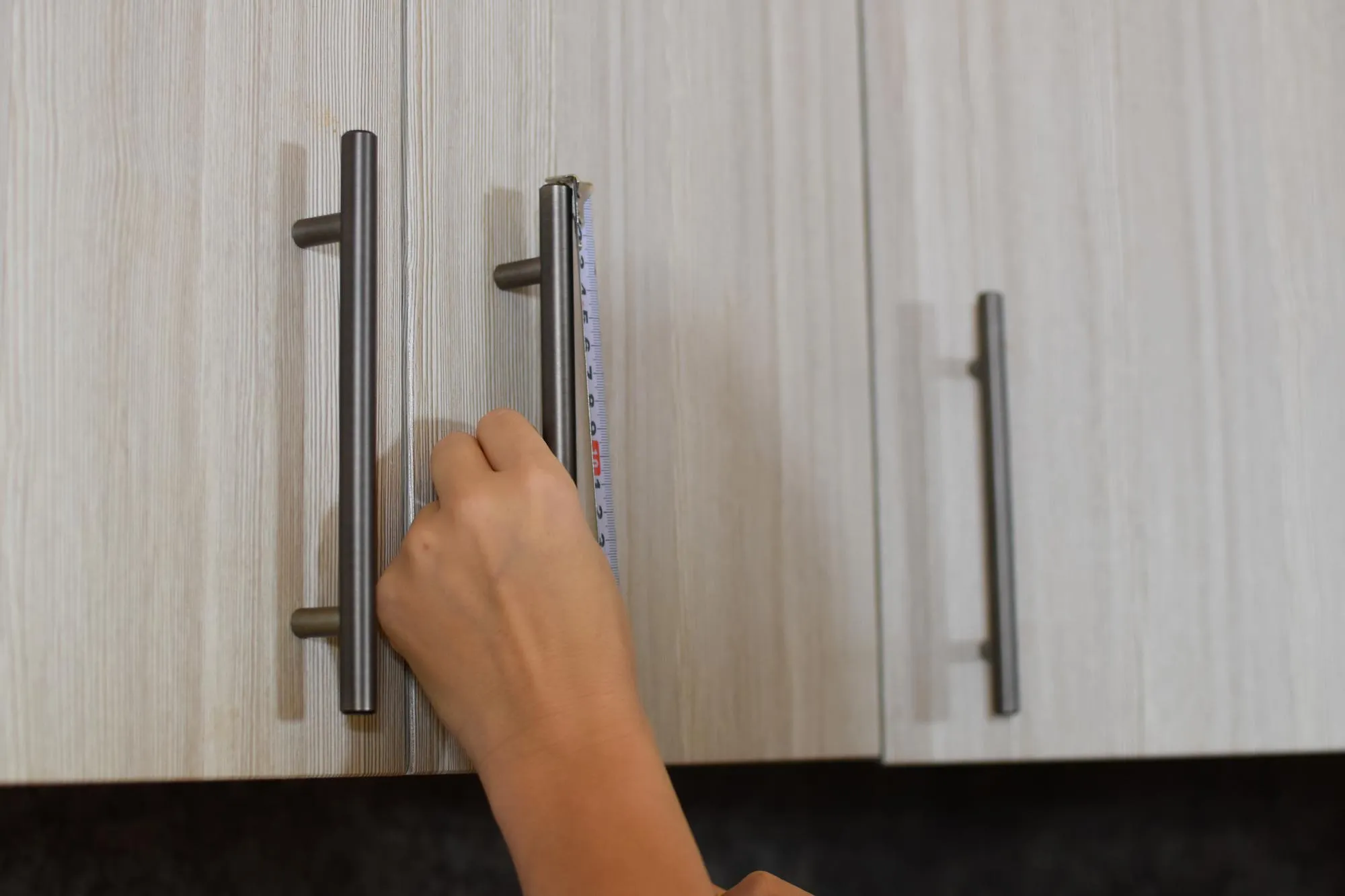 woman makes repairs in apartment builder girl at home repairs kitchen housewife fixes furniture