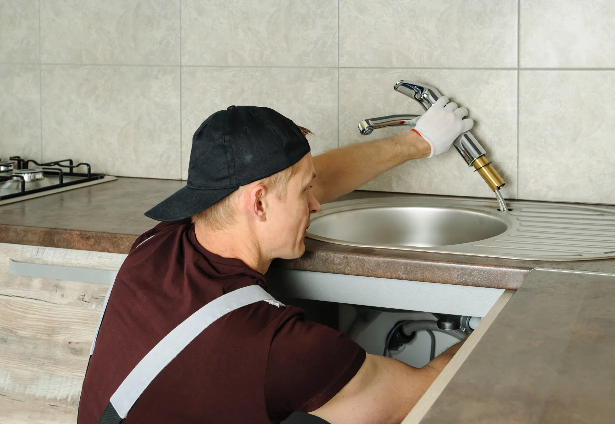 Worker installs faucet.