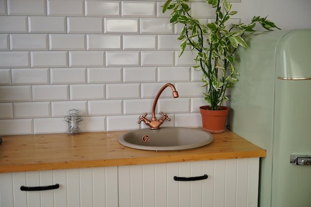 Close up of old kitchen faucet and sink Shabby vintage tap in kitchen