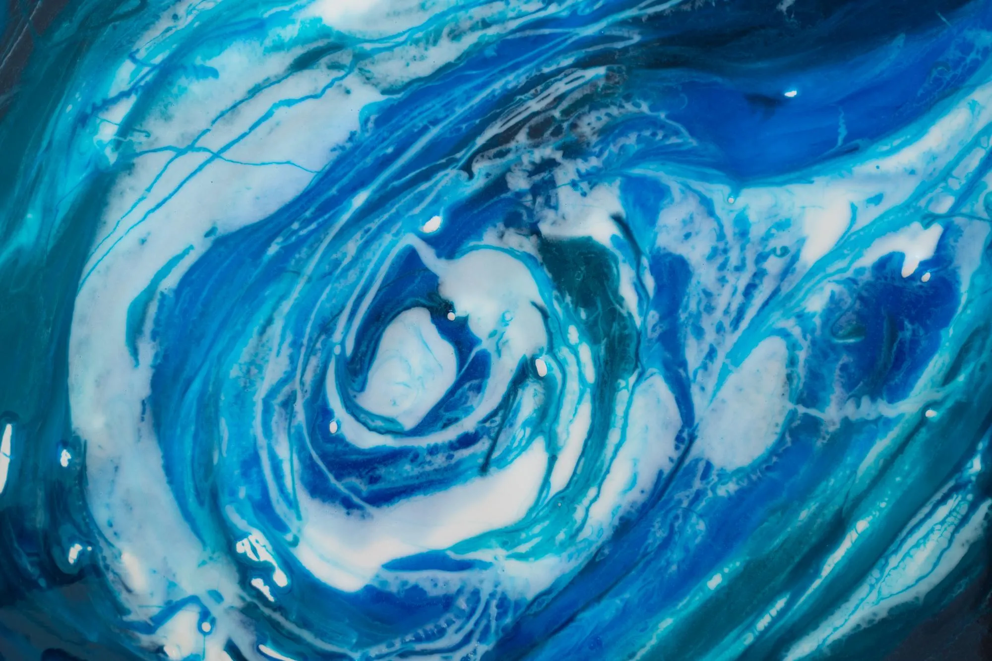 Epoxy resin art texture of blue and white paint fluid art kintsugi close up