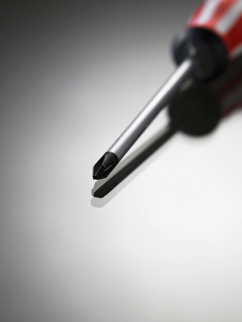 High angle view of screwdriver against white background