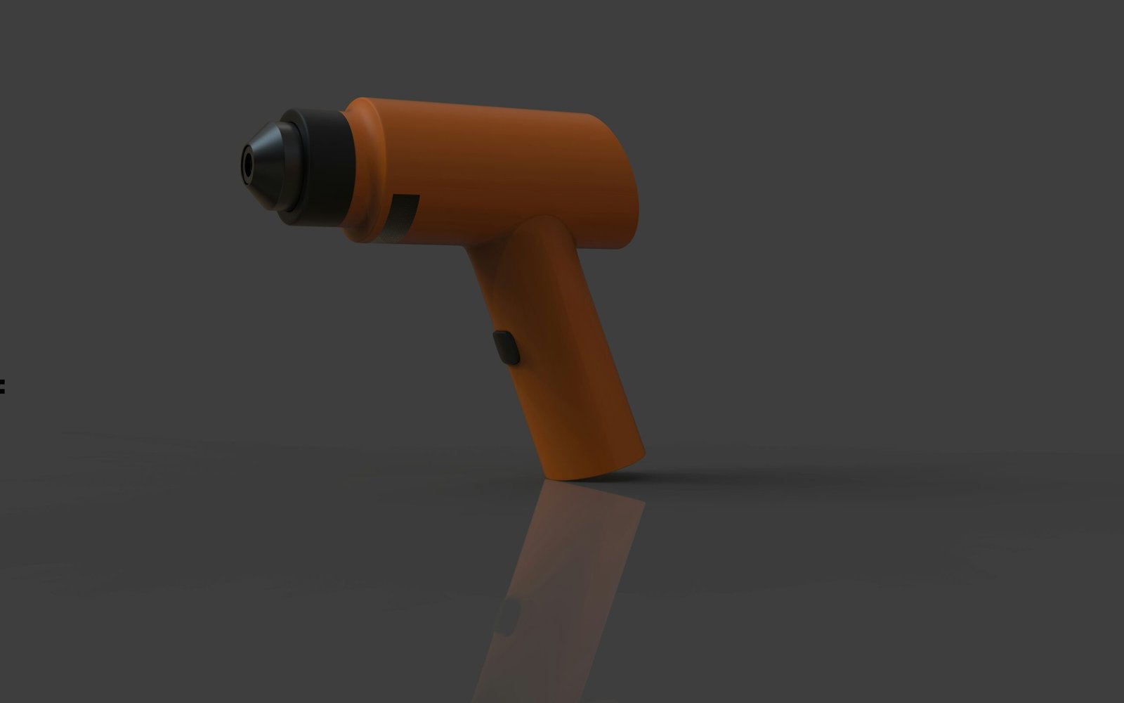 Orange cordless drill on a gray surface