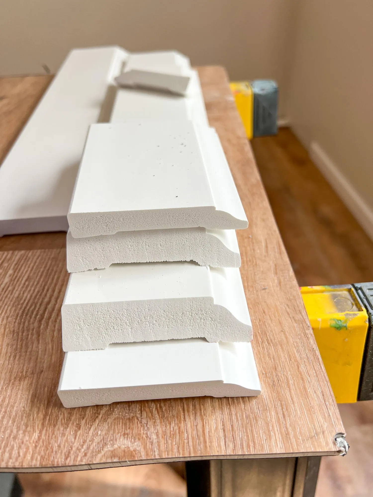Installing vinyl baseboards in a modern home renovation project