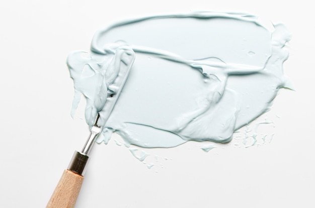 The texture of cosmetic moisturizer with palette knife