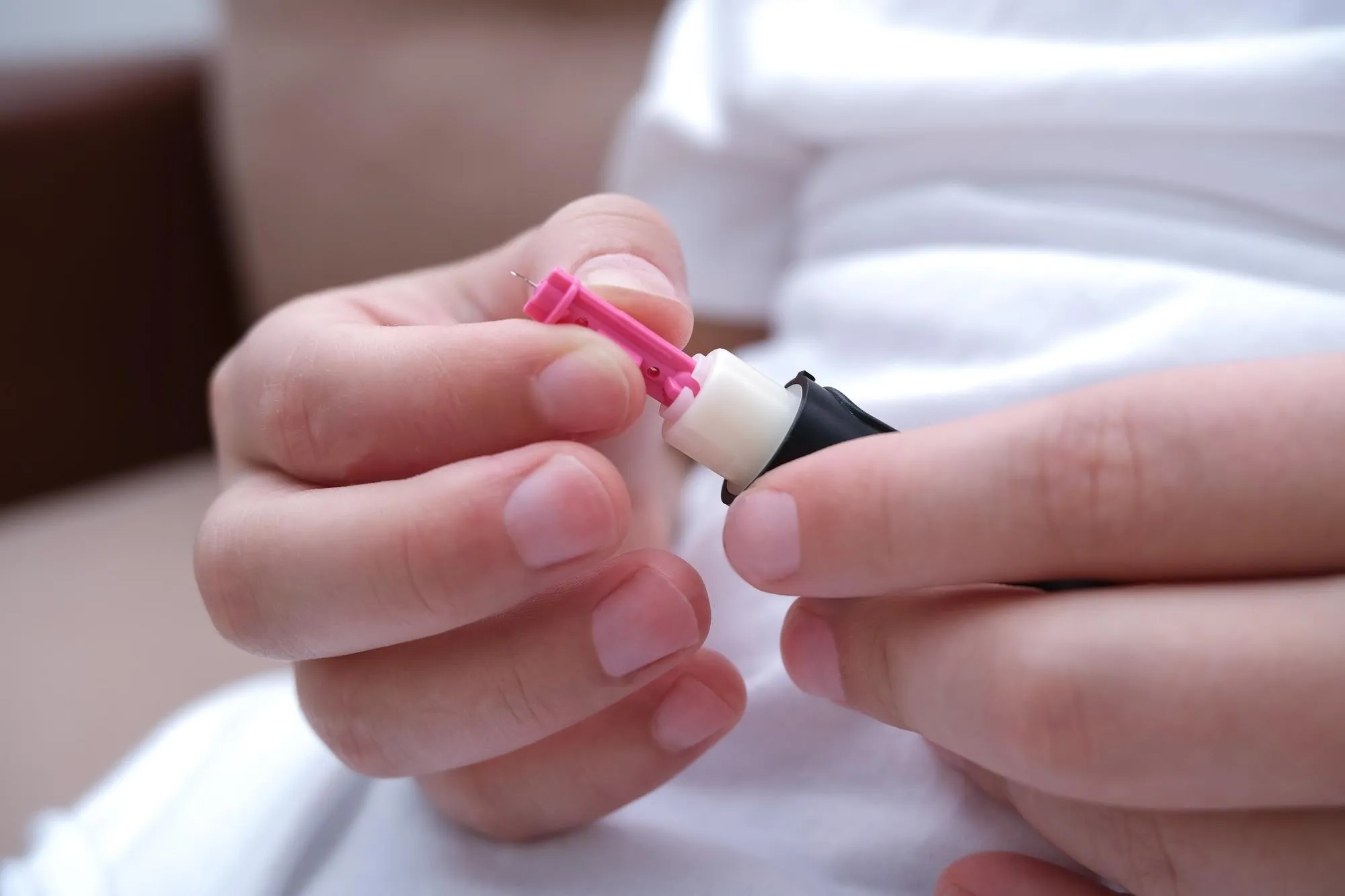 The child measures his blood sugar level