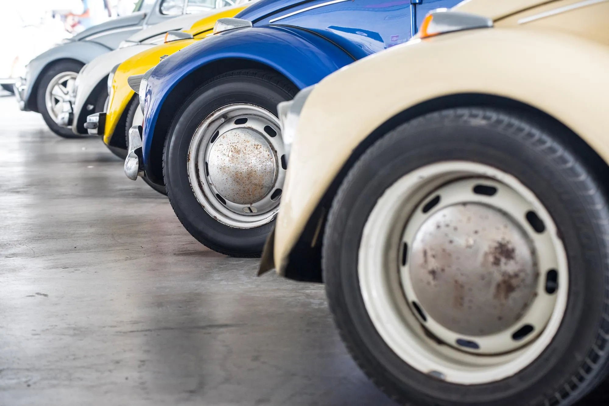 Close-up of vintage cars parked in showroom