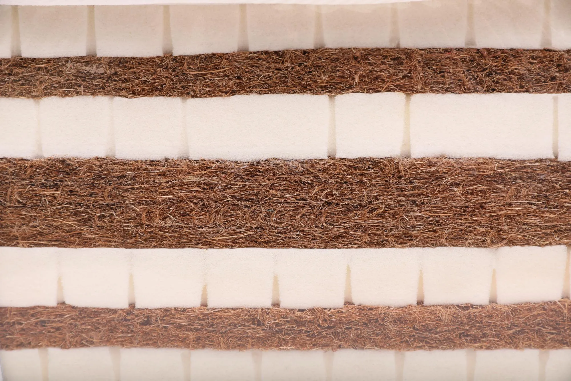 Sample of modern orthopedic mattress as background closeup