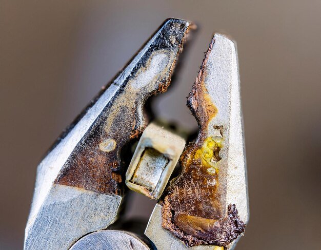 This closeup shows pliers burning due to electric current