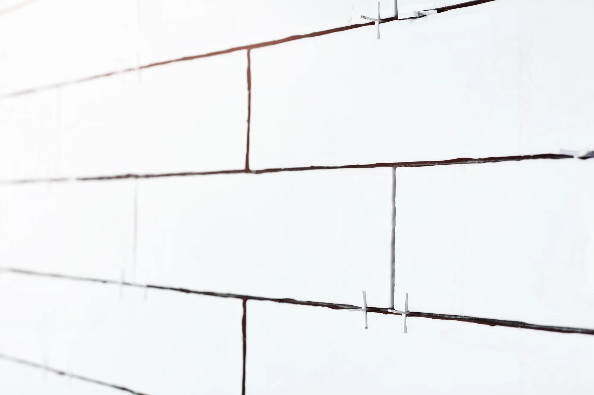 White light brick tiles wall texture wide background in rustic style Structure and pattern of destroyed stone grunge wall Retro style background Copy space