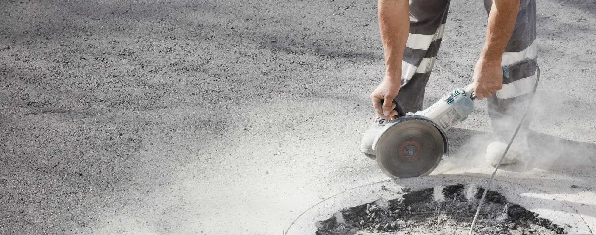 worker detail plane with radial and uniform, asphalt in the background