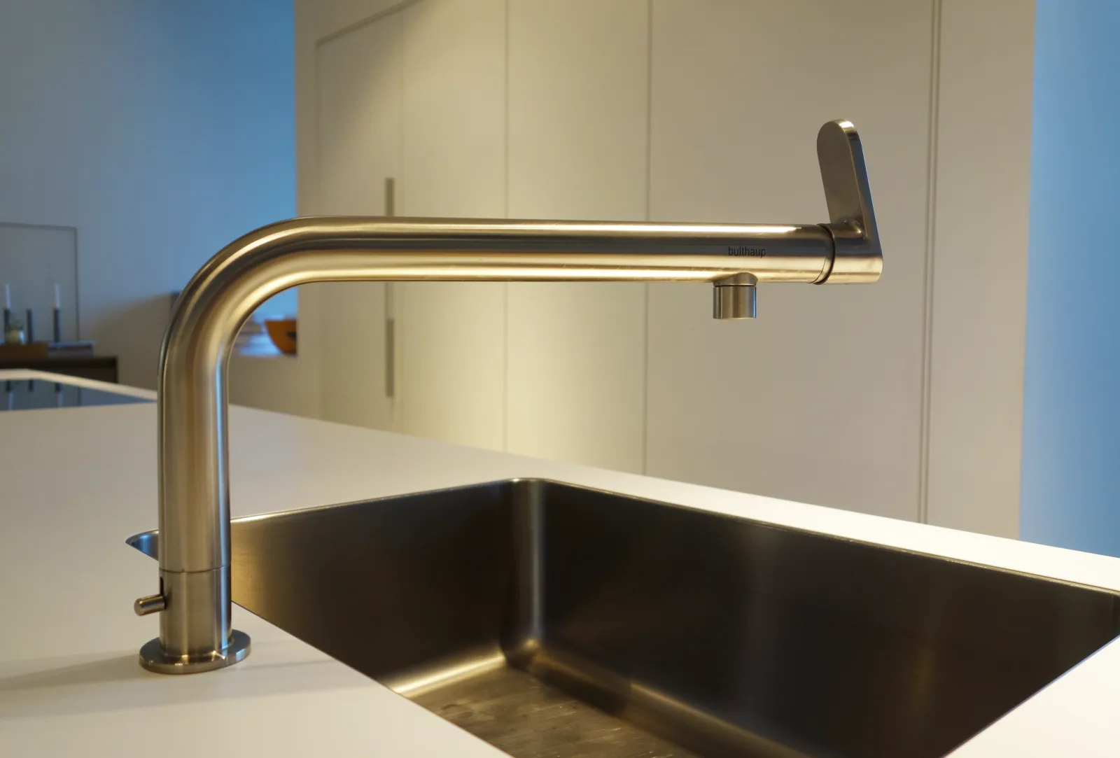 Bulthaup faucet, and an undermount sink where the countertop has been milled up to the top-laminate