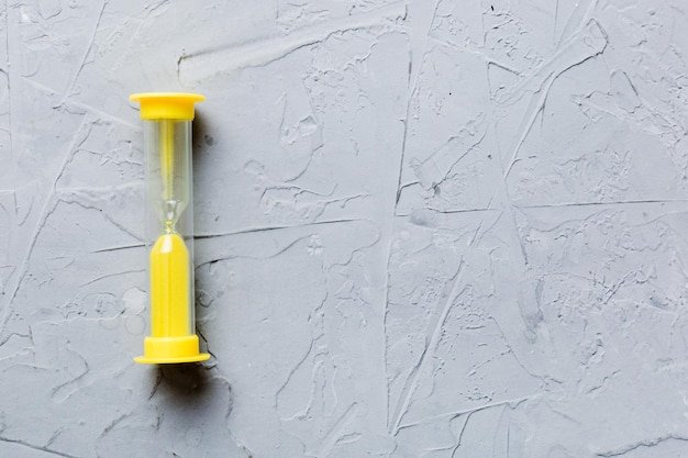 hourglass on the table sand clock as time passing concept for business deadline copy space