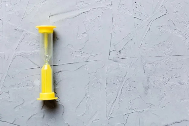hourglass on the table sand clock as time passing concept for business deadline copy space