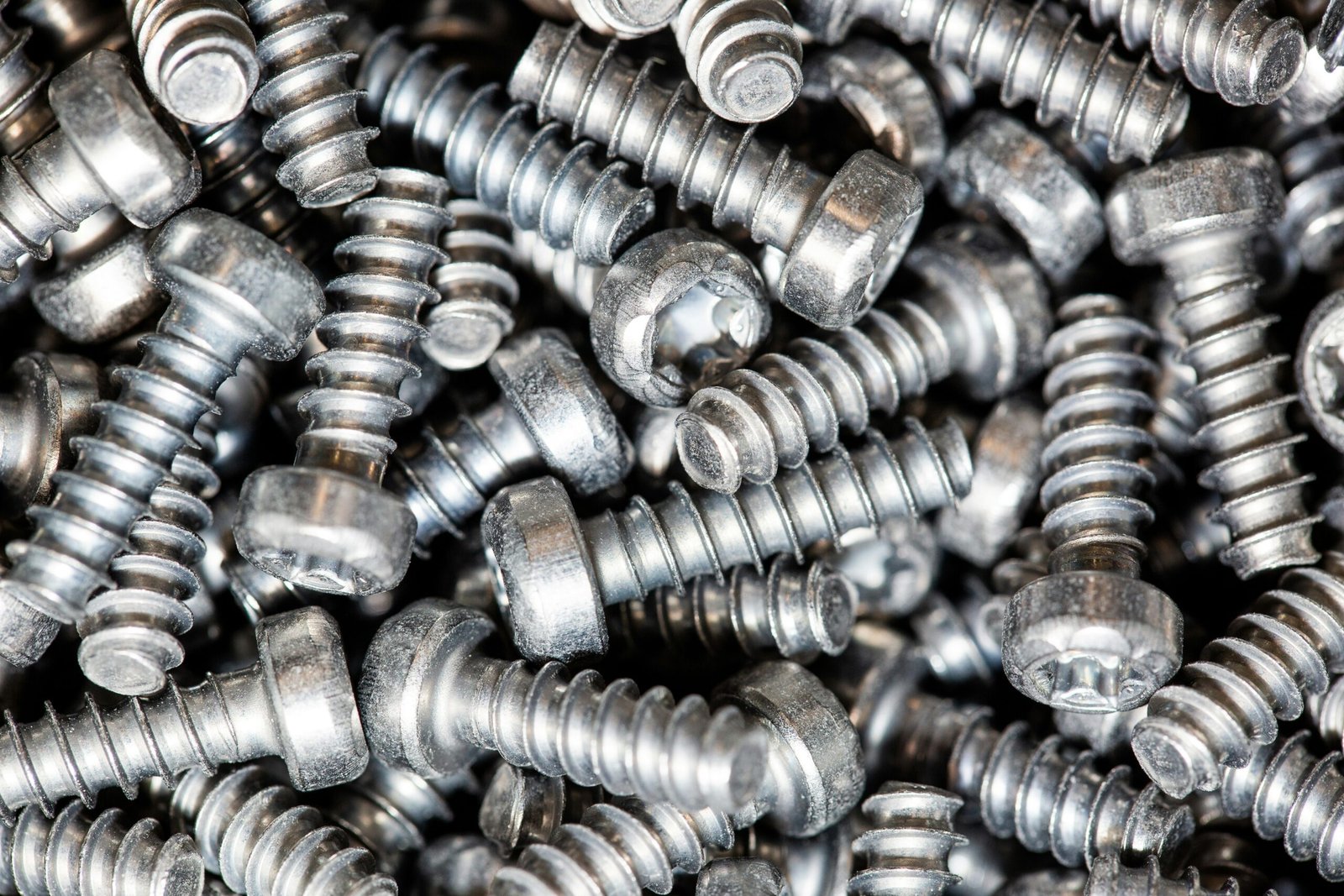 a pile of metal screws that are stacked on top of each other
