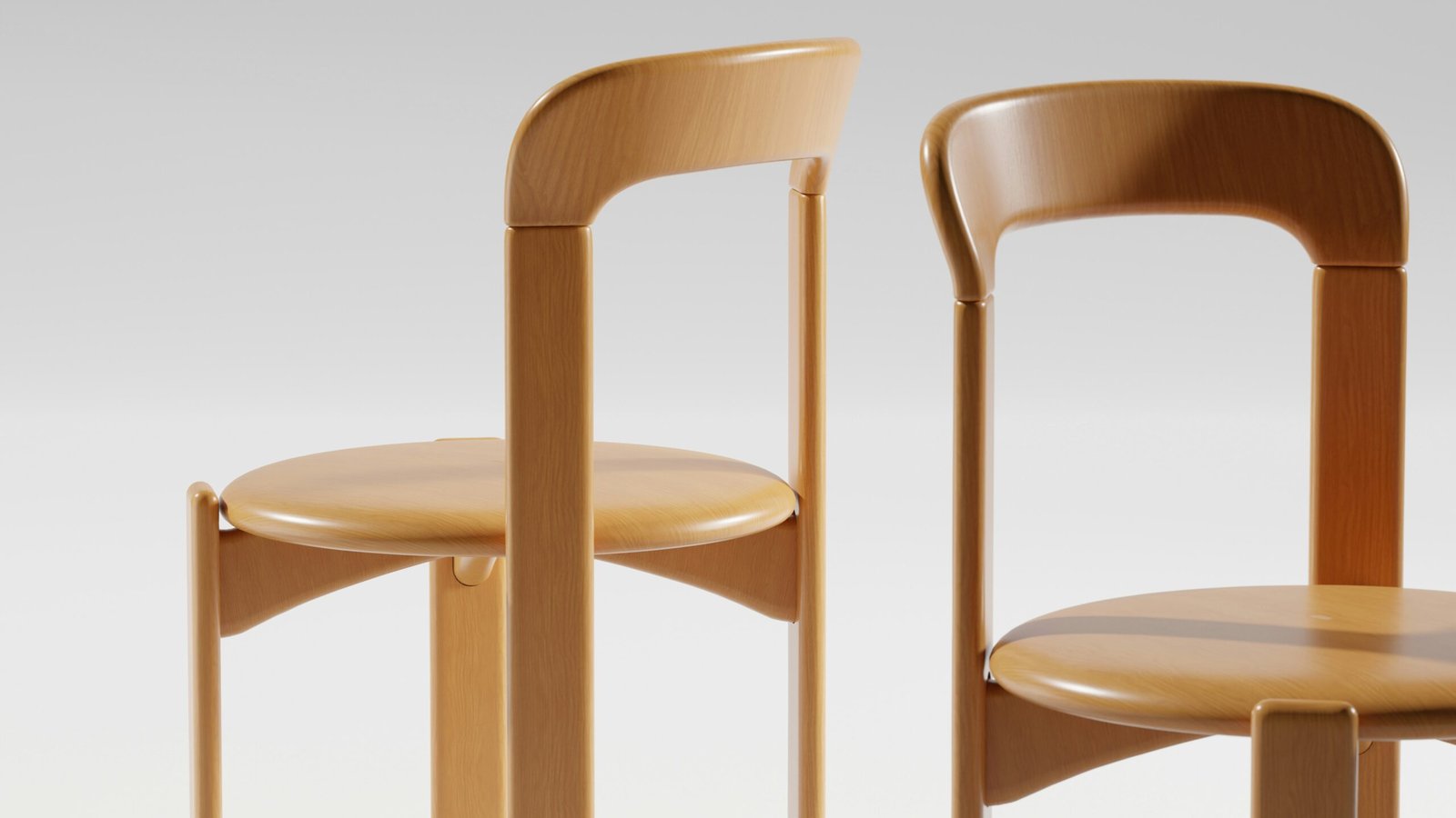 Two wooden chairs stand side by side.