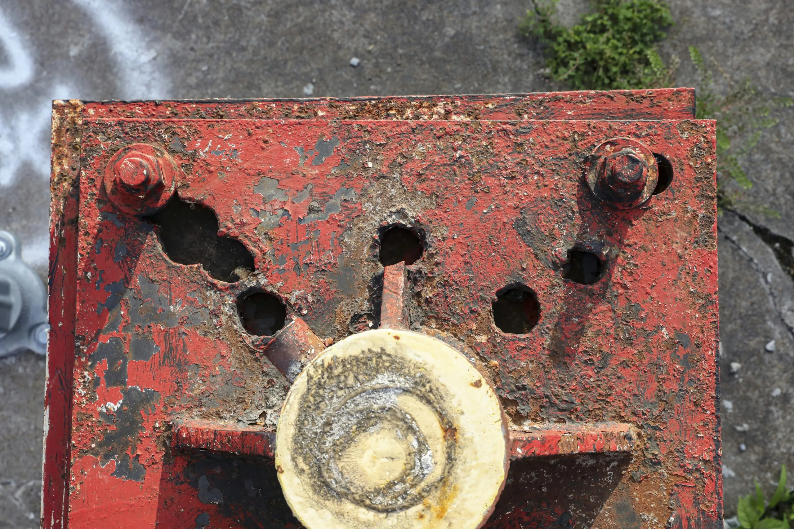 brown metal pipe with hole