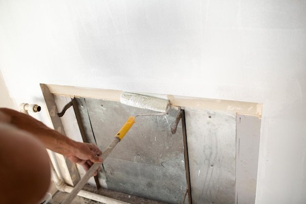 Man working on wall at home