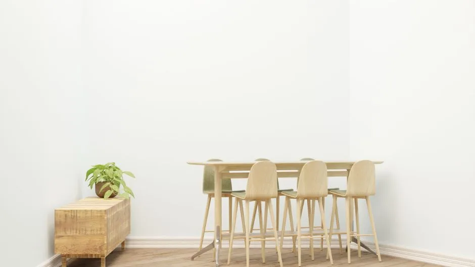 Bright minimalist dining area with wooden furniture and indoor plant, ideal for modern interiors.