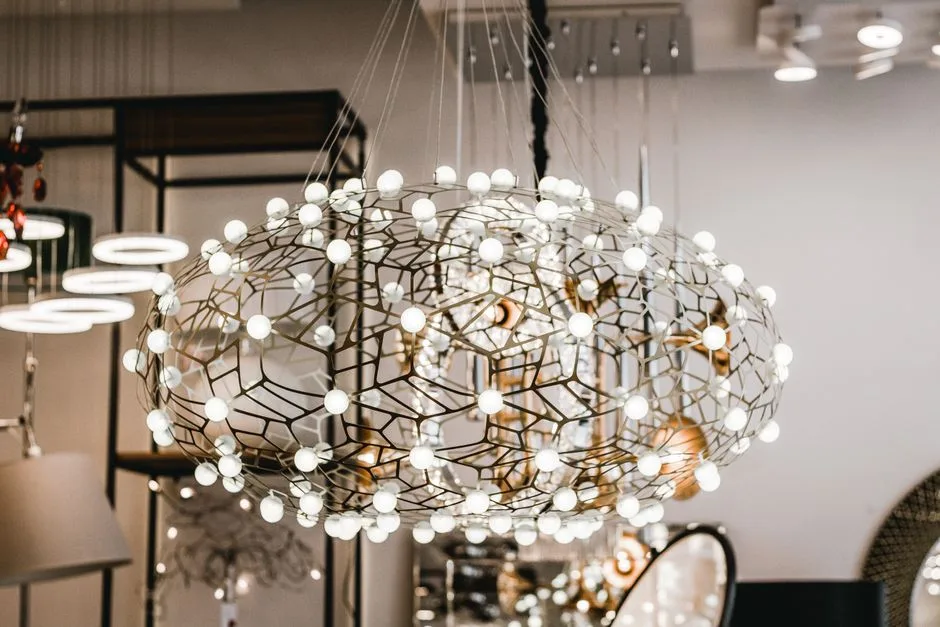 A contemporary geometric chandelier in a stylish room with varied lighting designs.