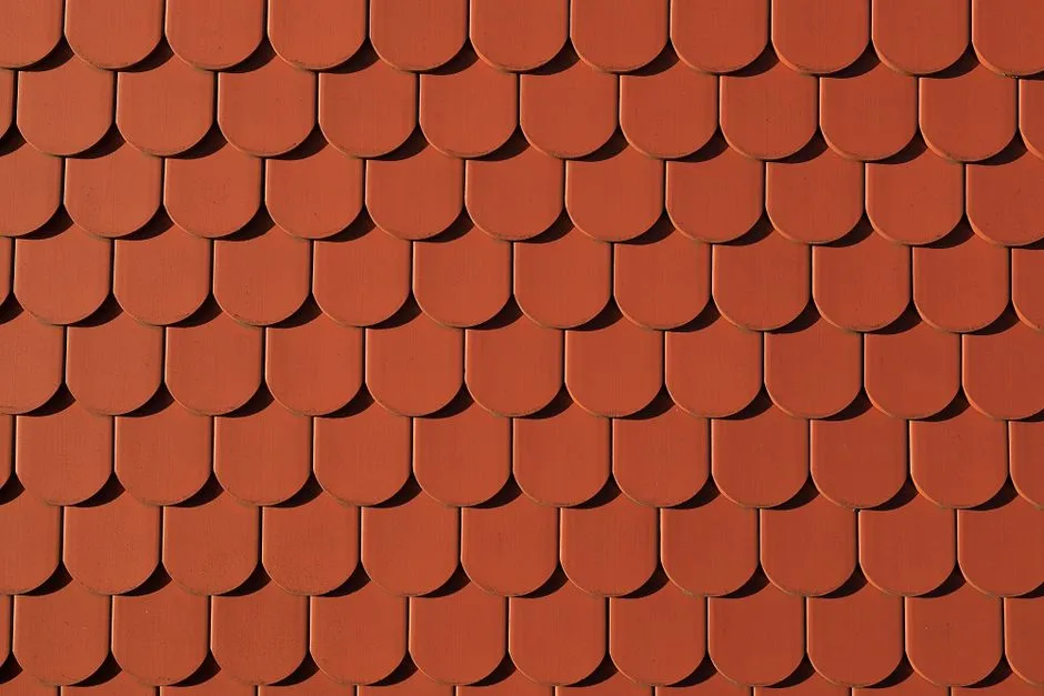 Close-up of red roof tiles creating a uniform pattern, architectural detail.