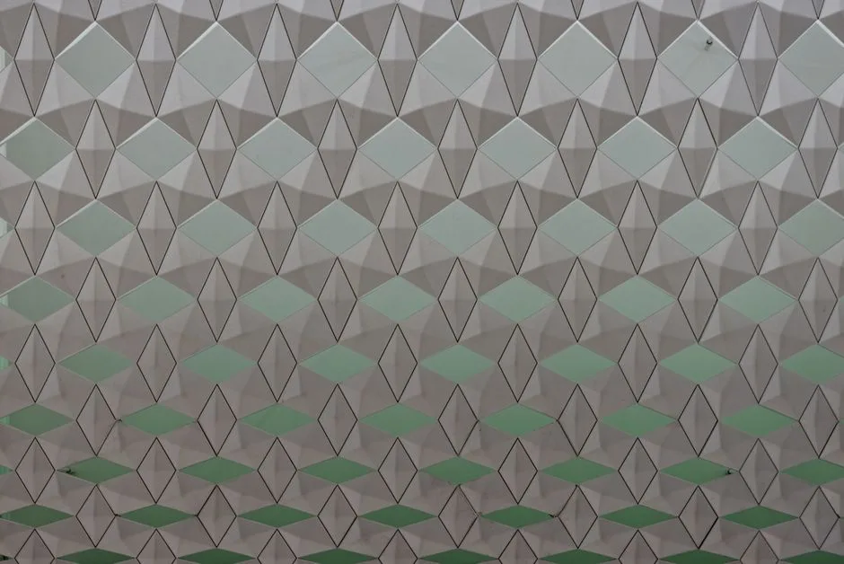 Seamless geometric pattern featuring diamond shapes in a soft color gradient.