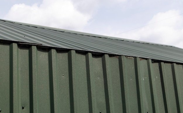 Roofing from a metal profile Metal roof structure Textured green metal roof Corrugated lining