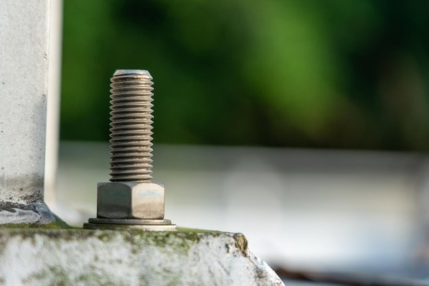 Selective focus shot of a bolt on an outdoor construction