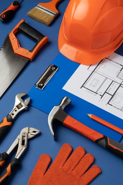 View of steel hammer with other construction elements and tools