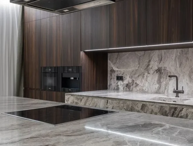 Interior design of spacious stylish modern kitchen with induction stove and air extraction system with wooden cupboards