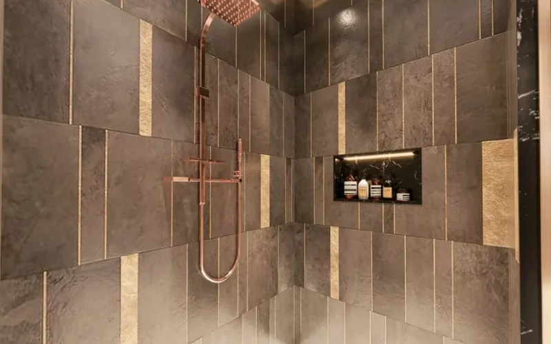 Luxurious modern shower with dark textured tiles and copper fixtures for a sophisticated bathroom design.