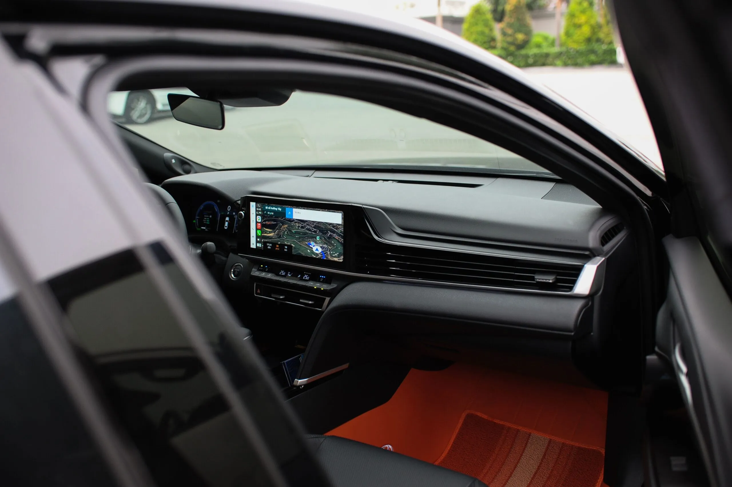 Interior view of a modern car showcasing a GPS navigation system on the dashboard screen.